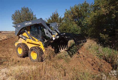 clearing land with a skid steer|john deere land clearing equipment.